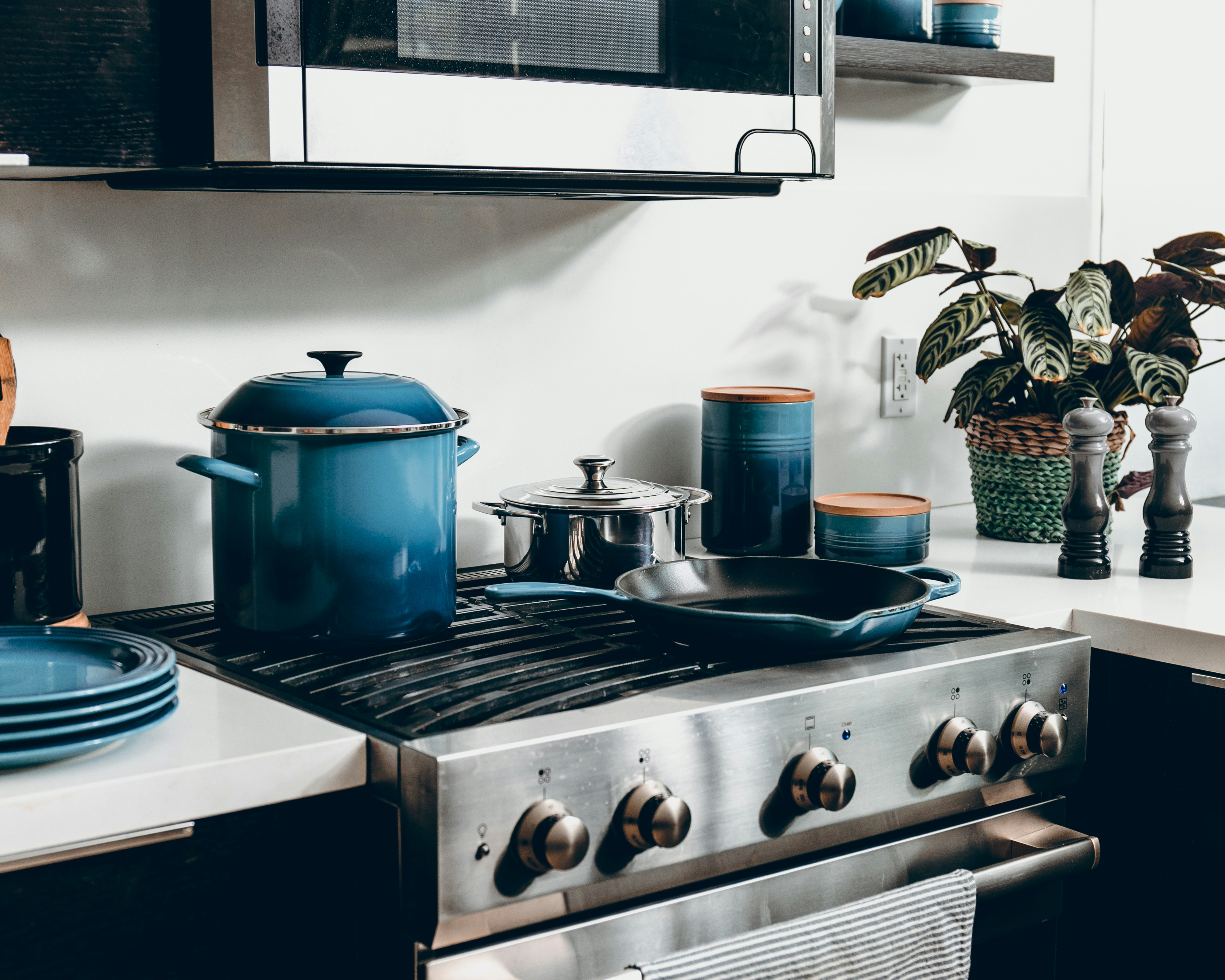 Blue pots and pans on stove top