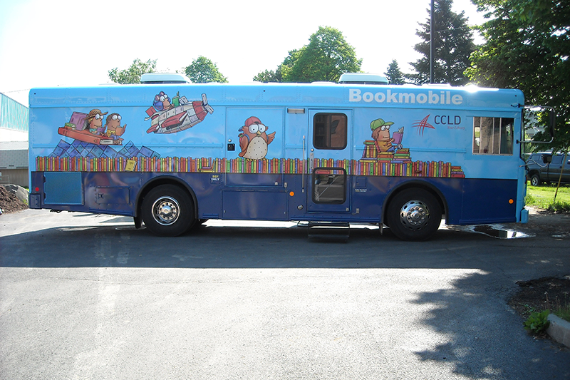 Bookmobile parked in the library parking lot