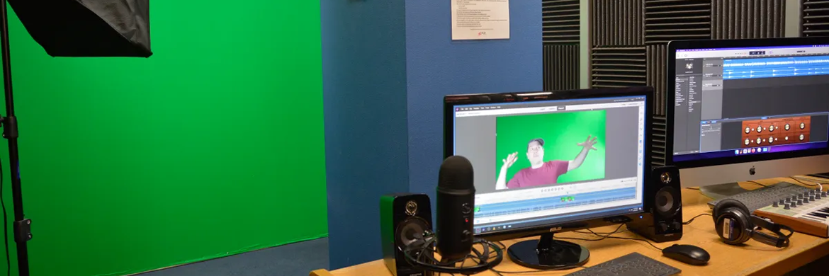 Digital Media Lab header showing a green screen set up with two computer monitors on a desk