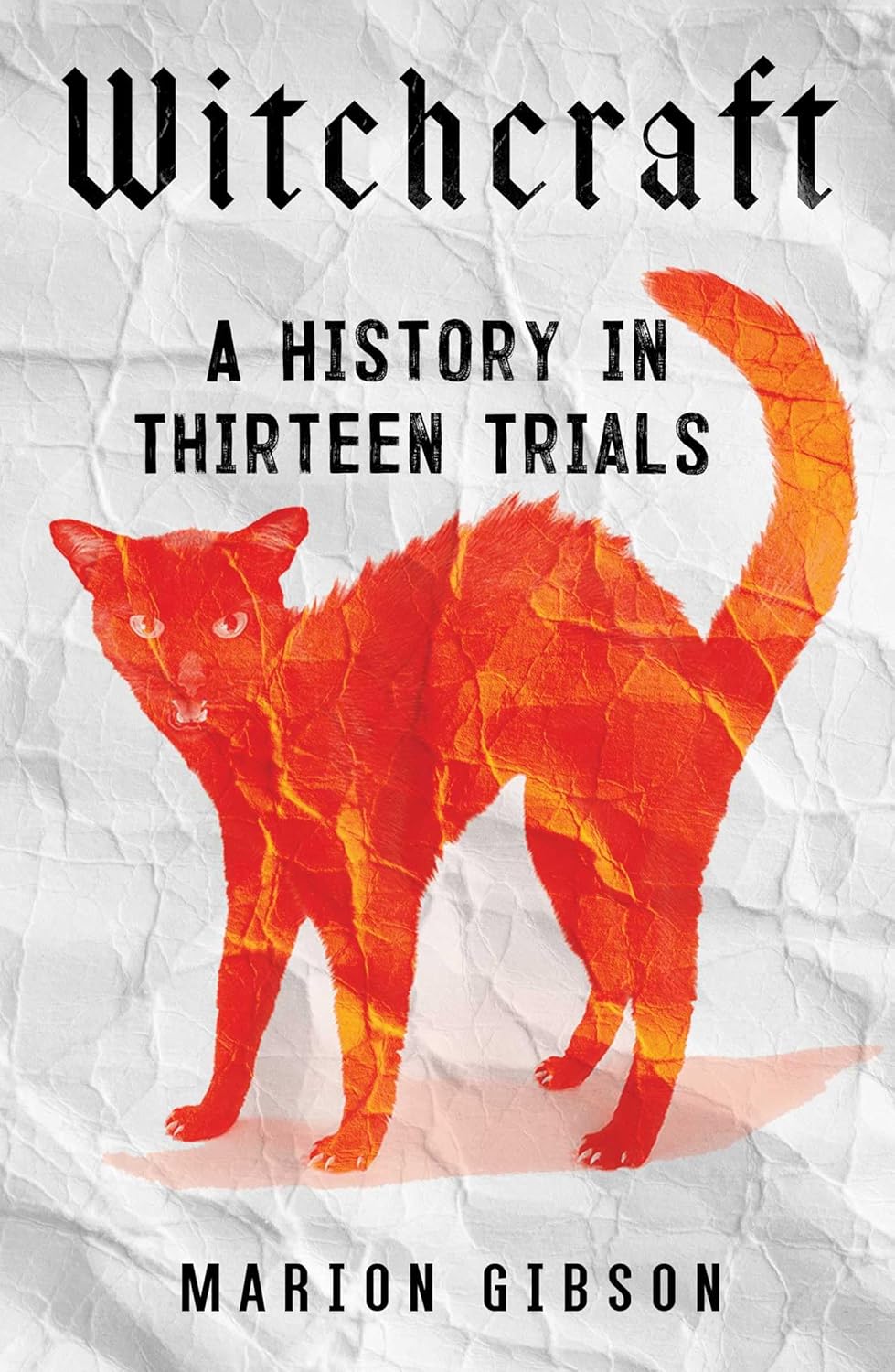 The cover of Witchcraft: A History in Thirteen Trials shows an orange cat on a white background