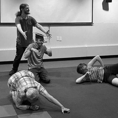 library patrons in various poses, playing improv games