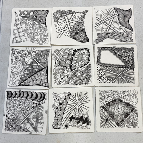 A 3x3 grid of pattern drawings (tangles/doodles in various patterns)