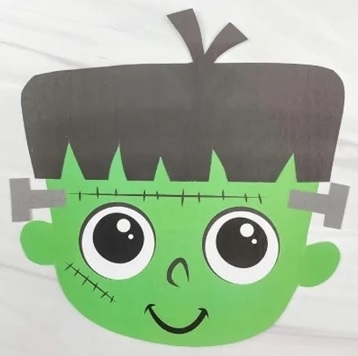 Frankenstein paper craft with black hair, green face and gray bolts.