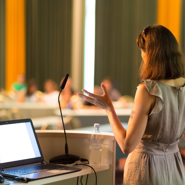 woman speaking at a podium