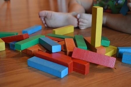 Young child playing with blocks.